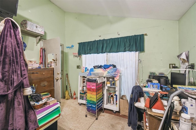 bedroom featuring light colored carpet and lofted ceiling