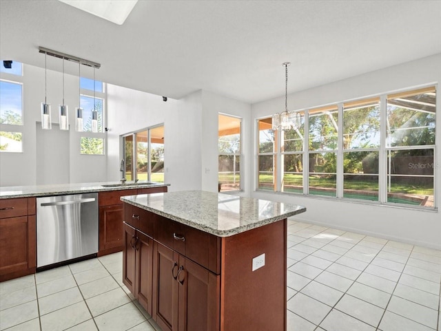 kitchen with a healthy amount of sunlight, dishwasher, hanging light fixtures, and sink