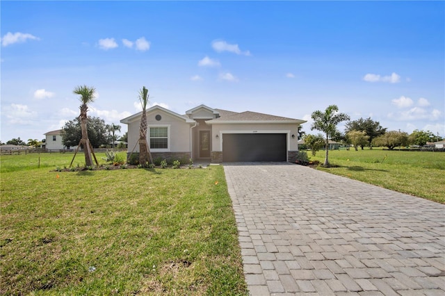 ranch-style home featuring a garage and a front lawn