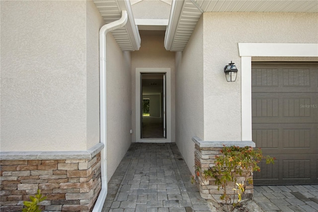 doorway to property featuring a garage