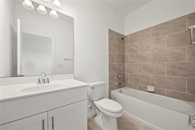 full bathroom with tile patterned flooring, tiled shower / bath combo, toilet, and vanity