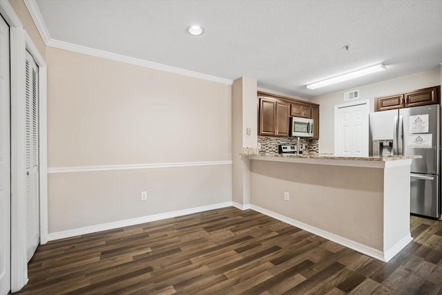 kitchen featuring crown molding, dark hardwood / wood-style floors, decorative backsplash, kitchen peninsula, and stainless steel appliances