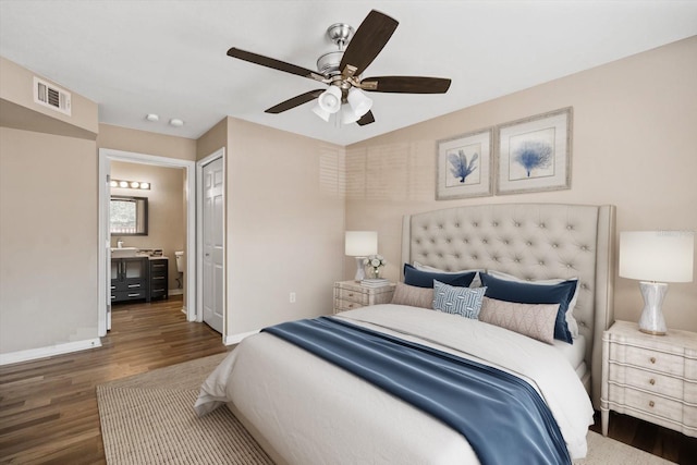 bedroom featuring ceiling fan, dark hardwood / wood-style flooring, and a closet