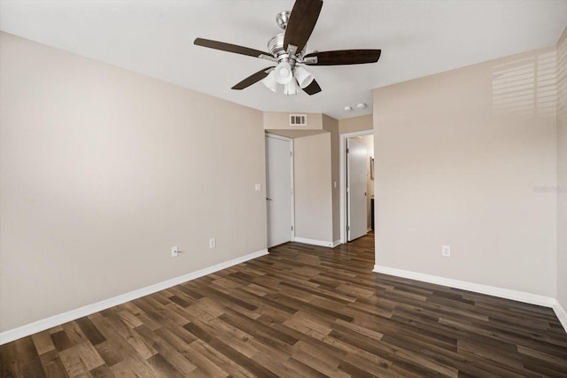 unfurnished room with ceiling fan and dark hardwood / wood-style flooring