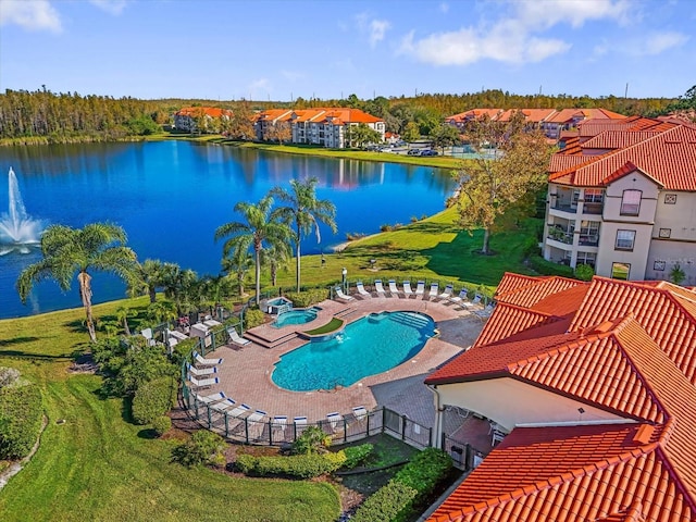 view of pool with a water view