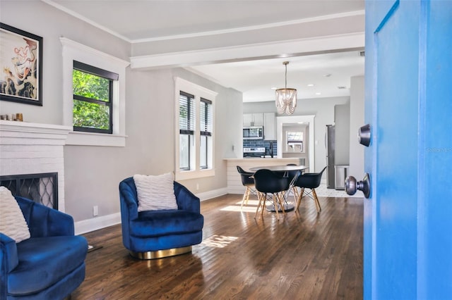 interior space with a fireplace, hardwood / wood-style floors, and a notable chandelier