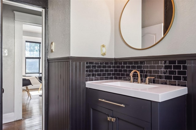 bathroom with hardwood / wood-style flooring and vanity