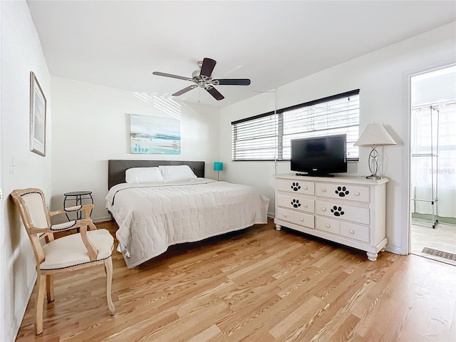 bedroom featuring light hardwood / wood-style flooring and ceiling fan