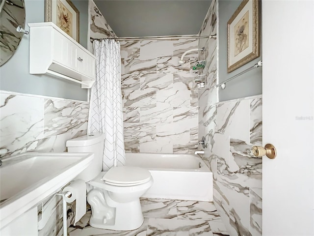 full bathroom with sink, toilet, tile walls, and shower / tub combo with curtain