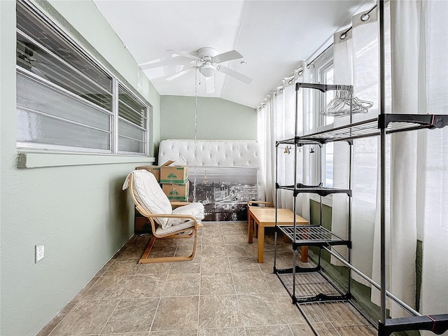 sunroom featuring ceiling fan and lofted ceiling