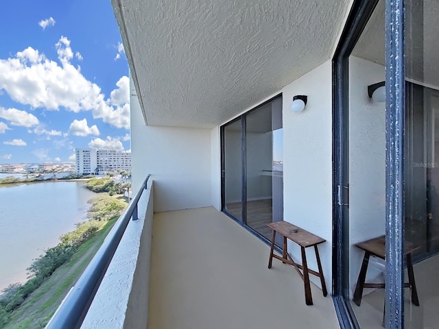 balcony featuring a water view