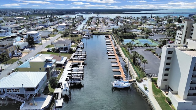 birds eye view of property featuring a residential view and a water view