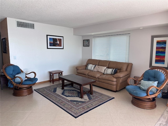 living room with a textured ceiling