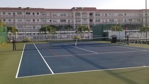 view of tennis court with basketball court