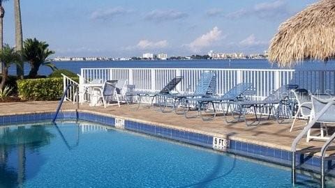 view of pool featuring a water view