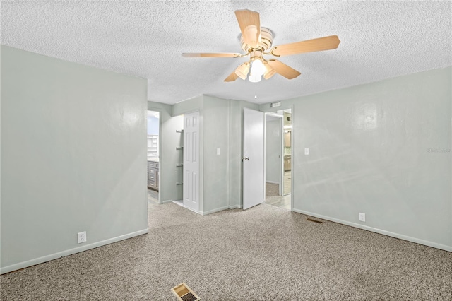 spare room featuring ceiling fan and a textured ceiling