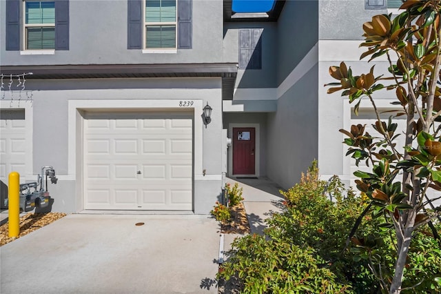 view of exterior entry featuring a garage