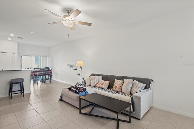 tiled living room featuring ceiling fan