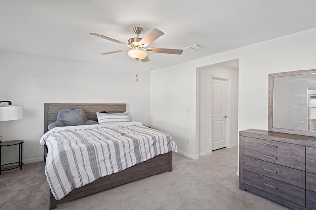 bedroom featuring ceiling fan and light colored carpet