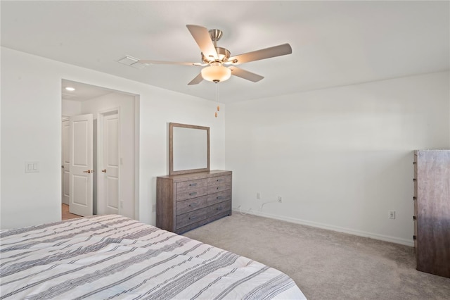 bedroom with light carpet and ceiling fan