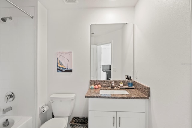 full bathroom featuring vanity, toilet, and tiled shower / bath combo