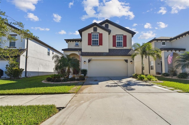 front facade featuring a garage and a front lawn