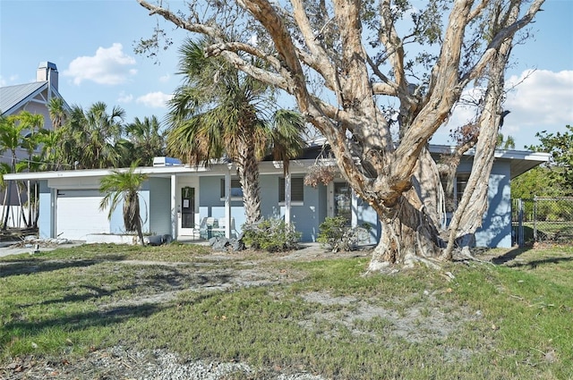 view of front of home with a porch and a garage