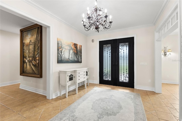 foyer entrance with a chandelier, light tile patterned flooring, ornamental molding, and french doors