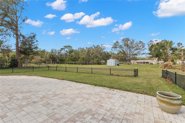 view of patio / terrace with a shed