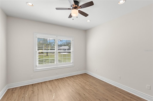 unfurnished room featuring ceiling fan and light hardwood / wood-style floors