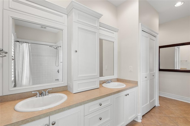 bathroom with tile patterned floors and vanity