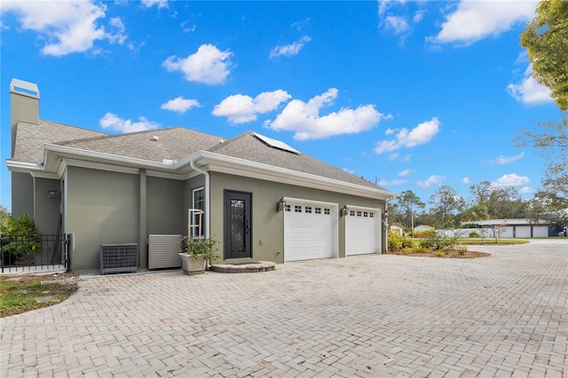 view of front of home with a garage