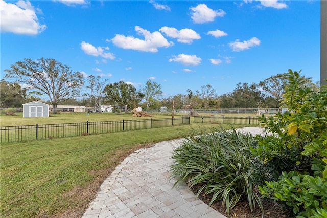 view of yard featuring a storage shed