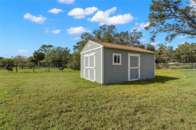 view of outdoor structure featuring a yard