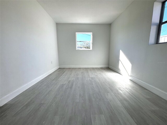 spare room featuring dark hardwood / wood-style floors