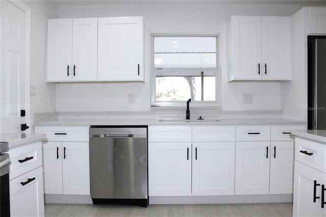 kitchen featuring white cabinets, sink, and appliances with stainless steel finishes