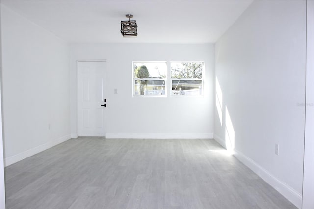 spare room with light hardwood / wood-style flooring