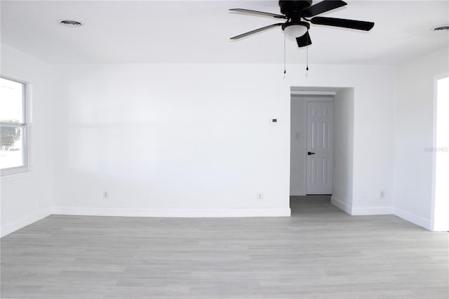 spare room with light hardwood / wood-style flooring and ceiling fan