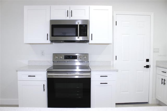 kitchen with white cabinets and stainless steel appliances