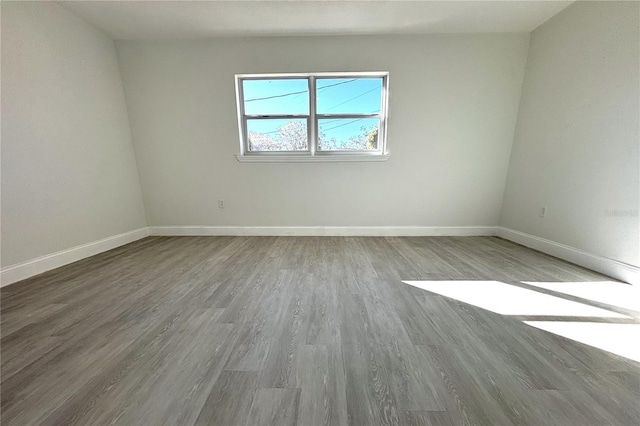 unfurnished room featuring hardwood / wood-style flooring