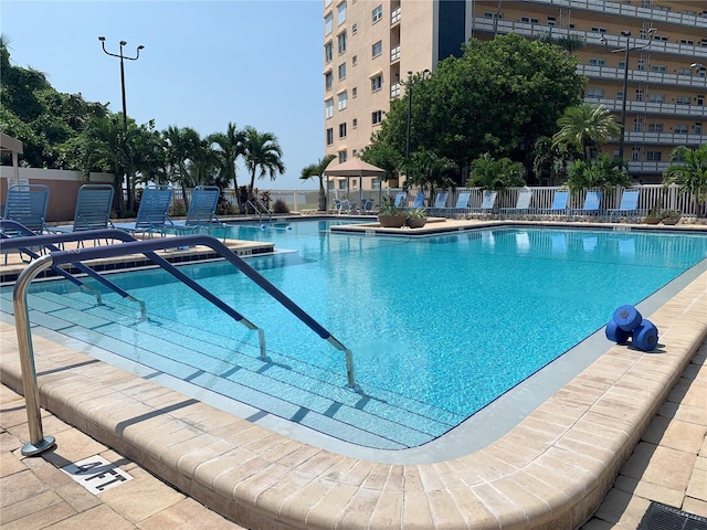 view of swimming pool with a patio area