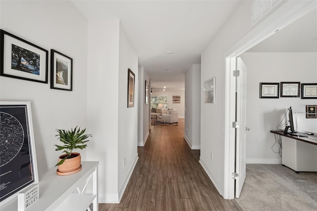 hallway featuring hardwood / wood-style flooring