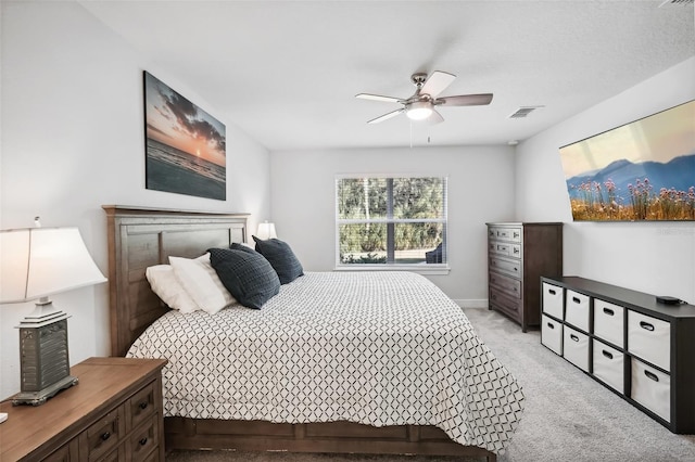 bedroom featuring light colored carpet and ceiling fan