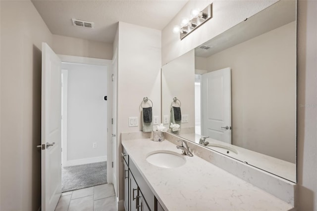 bathroom featuring tile patterned floors and vanity