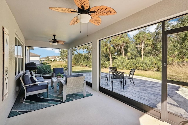 sunroom / solarium with ceiling fan and a wealth of natural light