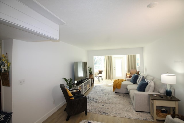 living room with light hardwood / wood-style flooring