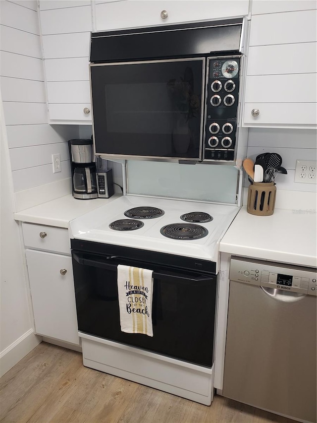 kitchen featuring backsplash, white cabinetry, light hardwood / wood-style flooring, and white appliances