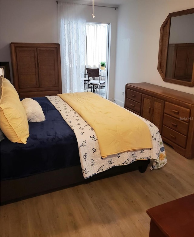 bedroom with light hardwood / wood-style floors