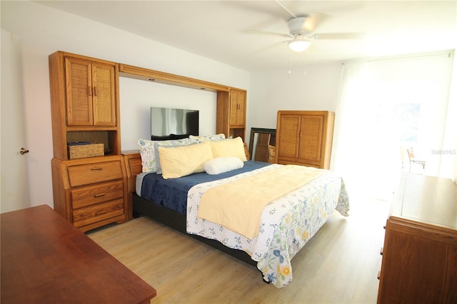 bedroom with ceiling fan and light hardwood / wood-style flooring