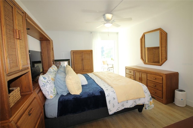 bedroom with wood-type flooring and ceiling fan